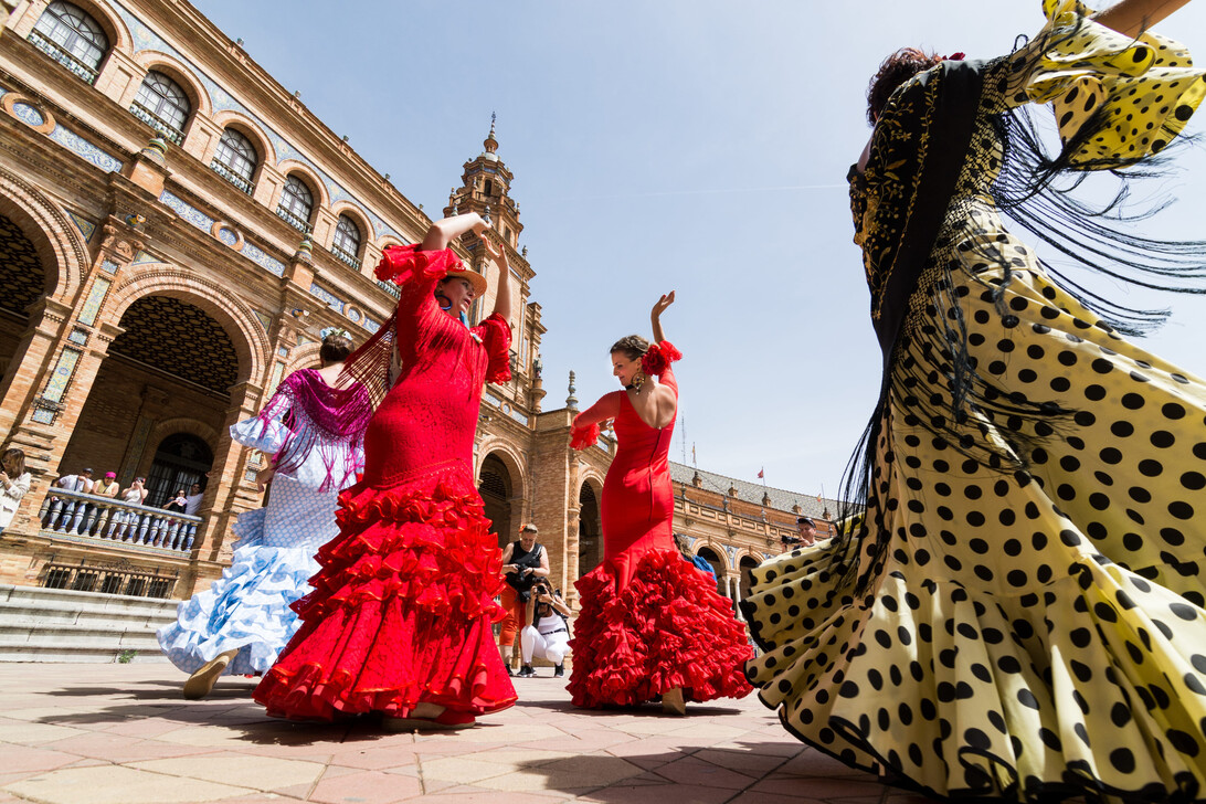 SEVILLE SPAIN - MAY 2017 Young women dance flamenco on Plaza de Espana | ComunicaTech.Com