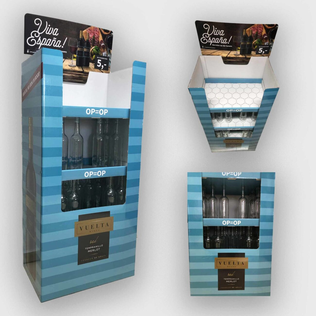 774160 - Letro | ComunicaTech.Com Blue striped wine display units with bottles visible on the shelves, featuring 'OP=OP' signs and a VUELTA Tempranillo Merlot label; promotional top card reads 'Viva España!'